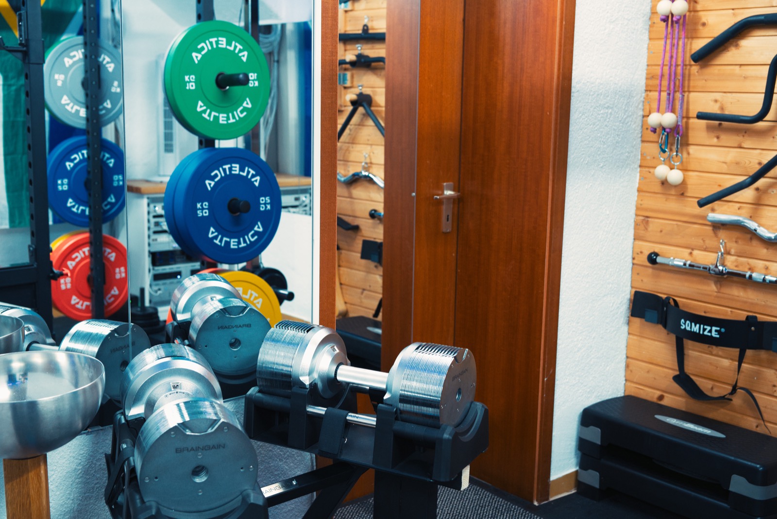Dumbbells, mirrors, and accessory wall details