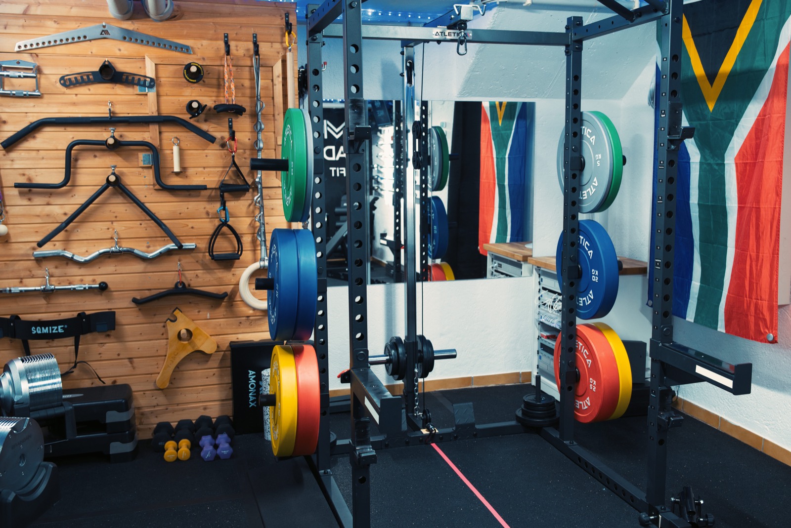Power rack and accessory wall inside the Made Fit home gym